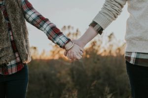 Couple holding hands